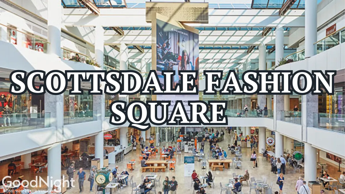 An interior scene of a vibrant, upscale shopping atrium, with a spacious central seating area, illuminated art display, and retail shops lining the walls. Shoppers and diners create a lively, cosmopolitan atmosphere, highlighting both shopping and dining experiences.